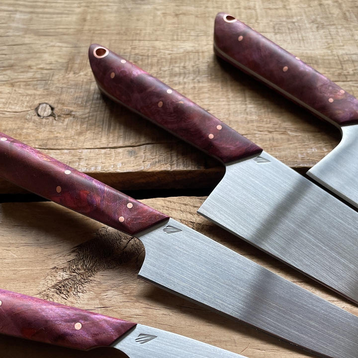 Kitchen knife set: chef’s knife, petty knife, paring knife, and mini-chef knife. Redroot blades 